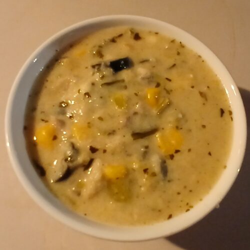 creamy Bayou Baked Fish Dip topped with melted cheese